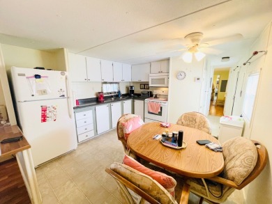 This home is located in a 55+ community in the back of the park on Lone Palm Golf Club in Florida - for sale on GolfHomes.com, golf home, golf lot