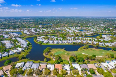 Enjoy breathtaking lake and golf course views from this on Monarch Country Club in Florida - for sale on GolfHomes.com, golf home, golf lot
