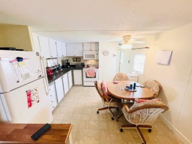 This home is located in a 55+ community in the back of the park on Lone Palm Golf Club in Florida - for sale on GolfHomes.com, golf home, golf lot