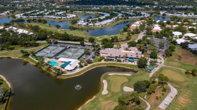 Enjoy breathtaking lake and golf course views from this on Monarch Country Club in Florida - for sale on GolfHomes.com, golf home, golf lot