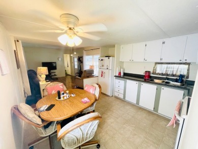 This home is located in a 55+ community in the back of the park on Lone Palm Golf Club in Florida - for sale on GolfHomes.com, golf home, golf lot