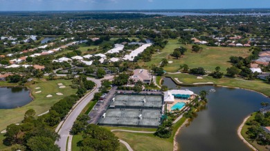 Enjoy breathtaking lake and golf course views from this on Monarch Country Club in Florida - for sale on GolfHomes.com, golf home, golf lot