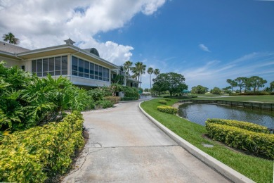 Enjoy breathtaking lake and golf course views from this on Monarch Country Club in Florida - for sale on GolfHomes.com, golf home, golf lot