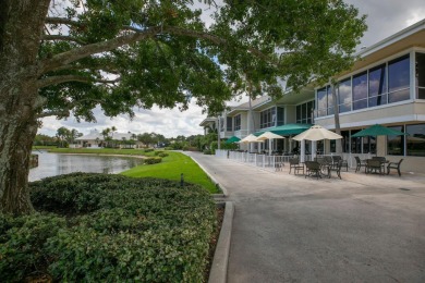 Enjoy breathtaking lake and golf course views from this on Monarch Country Club in Florida - for sale on GolfHomes.com, golf home, golf lot