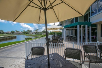 Enjoy breathtaking lake and golf course views from this on Monarch Country Club in Florida - for sale on GolfHomes.com, golf home, golf lot