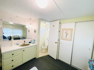 This home is located in a 55+ community in the back of the park on Lone Palm Golf Club in Florida - for sale on GolfHomes.com, golf home, golf lot