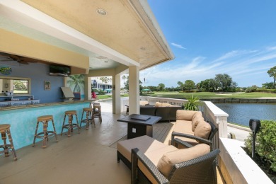 Enjoy breathtaking lake and golf course views from this on Monarch Country Club in Florida - for sale on GolfHomes.com, golf home, golf lot