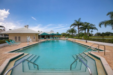 Enjoy breathtaking lake and golf course views from this on Monarch Country Club in Florida - for sale on GolfHomes.com, golf home, golf lot