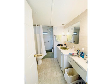 This home is located in a 55+ community in the back of the park on Lone Palm Golf Club in Florida - for sale on GolfHomes.com, golf home, golf lot