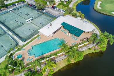Enjoy breathtaking lake and golf course views from this on Monarch Country Club in Florida - for sale on GolfHomes.com, golf home, golf lot