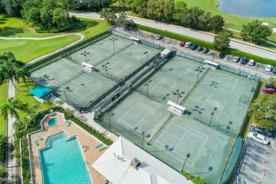Enjoy breathtaking lake and golf course views from this on Monarch Country Club in Florida - for sale on GolfHomes.com, golf home, golf lot