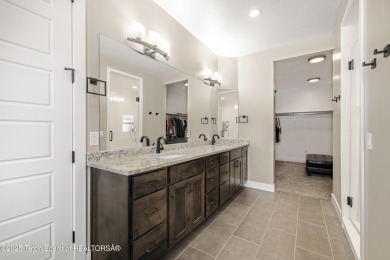 This stunning custom-built home sits on a generous lot right on on Star Valley RV Golf Course in Wyoming - for sale on GolfHomes.com, golf home, golf lot