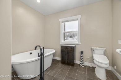 This stunning custom-built home sits on a generous lot right on on Star Valley RV Golf Course in Wyoming - for sale on GolfHomes.com, golf home, golf lot