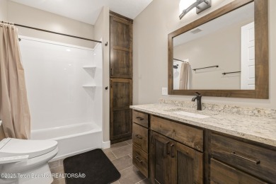 This stunning custom-built home sits on a generous lot right on on Star Valley RV Golf Course in Wyoming - for sale on GolfHomes.com, golf home, golf lot