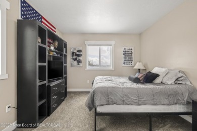 This stunning custom-built home sits on a generous lot right on on Star Valley RV Golf Course in Wyoming - for sale on GolfHomes.com, golf home, golf lot