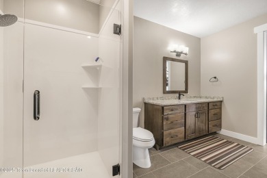 This stunning custom-built home sits on a generous lot right on on Star Valley RV Golf Course in Wyoming - for sale on GolfHomes.com, golf home, golf lot