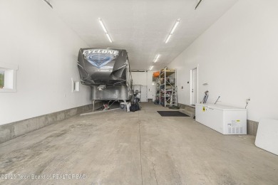 This stunning custom-built home sits on a generous lot right on on Star Valley RV Golf Course in Wyoming - for sale on GolfHomes.com, golf home, golf lot