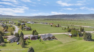 This stunning custom-built home sits on a generous lot right on on Star Valley RV Golf Course in Wyoming - for sale on GolfHomes.com, golf home, golf lot