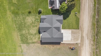 This stunning custom-built home sits on a generous lot right on on Star Valley RV Golf Course in Wyoming - for sale on GolfHomes.com, golf home, golf lot