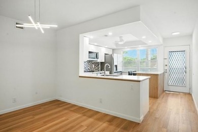 GORGEOUS! COMPLETELY REMODELED 2BEDROOM/2BATH Florida Room on Wynmoor Golf Course in Florida - for sale on GolfHomes.com, golf home, golf lot