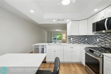 GORGEOUS! COMPLETELY REMODELED 2BEDROOM/2BATH Florida Room on Wynmoor Golf Course in Florida - for sale on GolfHomes.com, golf home, golf lot