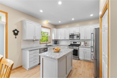 Stunning 5-bed, 4-bath home with a 3-car garage in Blaine's on TPC of the Twin Cities in Minnesota - for sale on GolfHomes.com, golf home, golf lot
