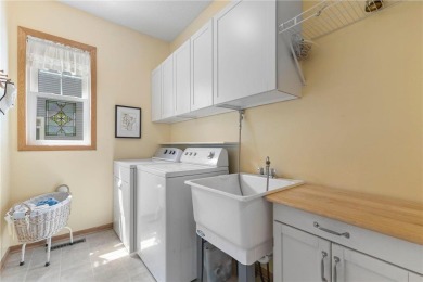 Stunning 5-bed, 4-bath home with a 3-car garage in Blaine's on TPC of the Twin Cities in Minnesota - for sale on GolfHomes.com, golf home, golf lot