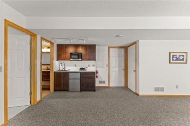 Stunning 5-bed, 4-bath home with a 3-car garage in Blaine's on TPC of the Twin Cities in Minnesota - for sale on GolfHomes.com, golf home, golf lot
