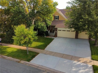 Stunning 5-bed, 4-bath home with a 3-car garage in Blaine's on TPC of the Twin Cities in Minnesota - for sale on GolfHomes.com, golf home, golf lot