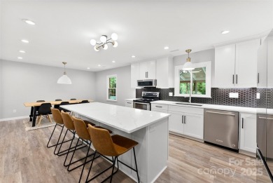 Welcome home to this beautifully updated gem in the heart of the on Raintree Country Club in North Carolina - for sale on GolfHomes.com, golf home, golf lot