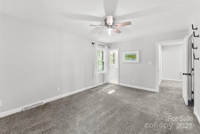 Welcome home to this beautifully updated gem in the heart of the on Raintree Country Club in North Carolina - for sale on GolfHomes.com, golf home, golf lot