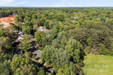 Welcome home to this beautifully updated gem in the heart of the on Raintree Country Club in North Carolina - for sale on GolfHomes.com, golf home, golf lot