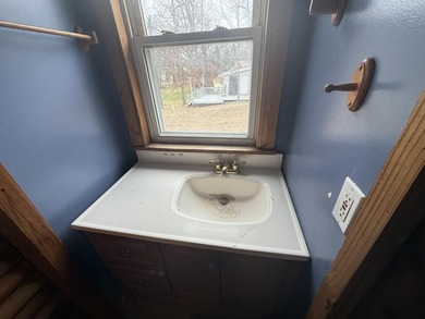 Investor or project-ready opportunity! This ranch with walkout on Hankerd Hills Golf Course in Michigan - for sale on GolfHomes.com, golf home, golf lot