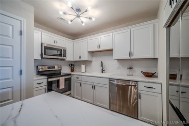 This 3 bedroom, 2 bath condo is sleek, modern & truly move-in on Seasons Ridge At Four Seasons in Missouri - for sale on GolfHomes.com, golf home, golf lot