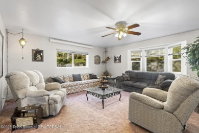 Discover mountain living at its finest with this stunning home on Star Valley RV Golf Course in Wyoming - for sale on GolfHomes.com, golf home, golf lot