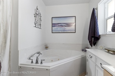 Discover mountain living at its finest with this stunning home on Star Valley RV Golf Course in Wyoming - for sale on GolfHomes.com, golf home, golf lot