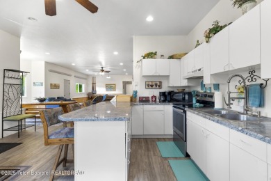 Discover mountain living at its finest with this stunning home on Star Valley RV Golf Course in Wyoming - for sale on GolfHomes.com, golf home, golf lot