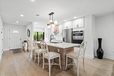 This contemporary townhouse, updated in 2022, effortlessly on Hunters Run Golf and Country Club in Florida - for sale on GolfHomes.com, golf home, golf lot