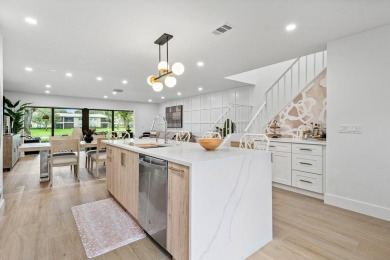 This contemporary townhouse, updated in 2022, effortlessly on Hunters Run Golf and Country Club in Florida - for sale on GolfHomes.com, golf home, golf lot