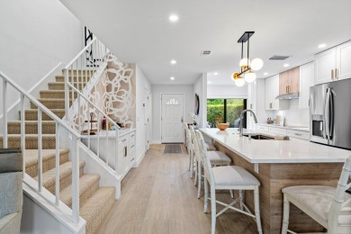 This contemporary townhouse, updated in 2022, effortlessly on Hunters Run Golf and Country Club in Florida - for sale on GolfHomes.com, golf home, golf lot