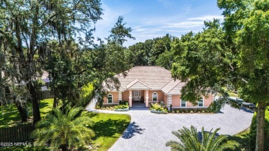 Experience luxury & tranquility in this stunning single-story on Magnolia Point Golf and Country Club in Florida - for sale on GolfHomes.com, golf home, golf lot