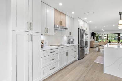 This contemporary townhouse, updated in 2022, effortlessly on Hunters Run Golf and Country Club in Florida - for sale on GolfHomes.com, golf home, golf lot