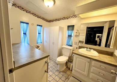 This charming open floorplan 2/bd, 2/ba home + Family Room on Del Tura Golf and Country Club in Florida - for sale on GolfHomes.com, golf home, golf lot