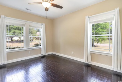 Step into luxury and comfort with this stunning executive-style on Wild Wing Plantation in South Carolina - for sale on GolfHomes.com, golf home, golf lot