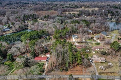 Build your dream home on this beautiful half-acre lot in the on Forest Oaks Country Club in North Carolina - for sale on GolfHomes.com, golf home, golf lot