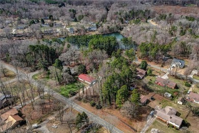 Build your dream home on this beautiful half-acre lot in the on Forest Oaks Country Club in North Carolina - for sale on GolfHomes.com, golf home, golf lot