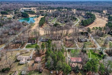 Build your dream home on this beautiful half-acre lot in the on Forest Oaks Country Club in North Carolina - for sale on GolfHomes.com, golf home, golf lot