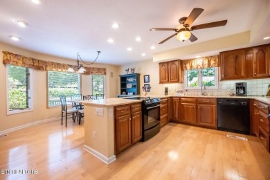 This lovely lakefront home located in a quiet cove, is nestled on Toqua Golf Course - Loudon County in Tennessee - for sale on GolfHomes.com, golf home, golf lot