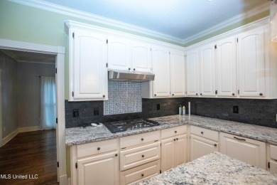 Welcome to 132 Pine Ridge Circle--an exceptional two-story home on Bay Pointe Golf and Resort in Mississippi - for sale on GolfHomes.com, golf home, golf lot