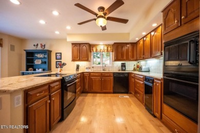 This lovely lakefront home located in a quiet cove, is nestled on Toqua Golf Course - Loudon County in Tennessee - for sale on GolfHomes.com, golf home, golf lot